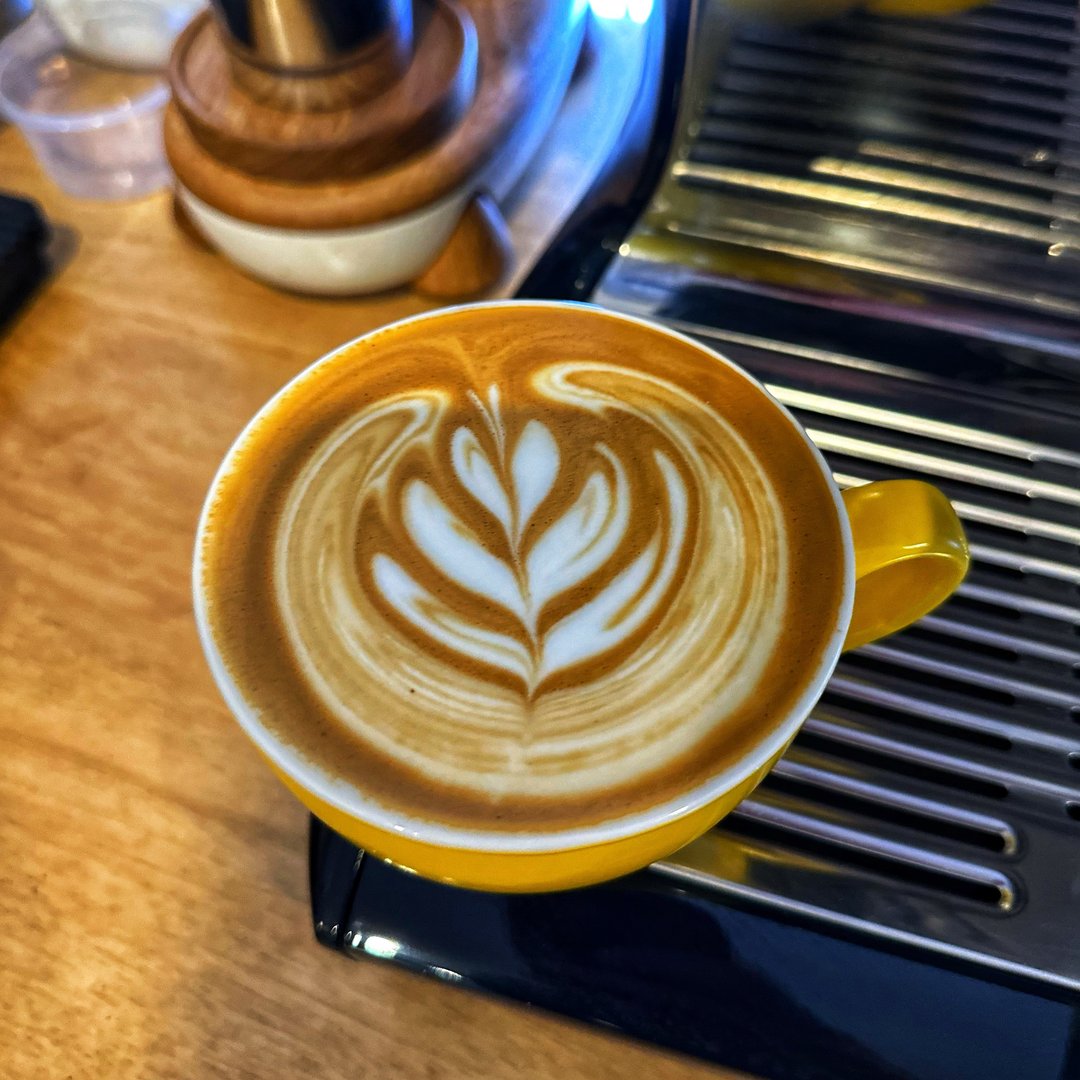 A photo of a coffee with latte art