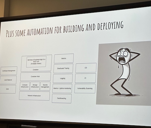 James's slide featuring all the elements needed to host containers in a modern environment. The list includes things like tracing, metrics, security, network infrastructure, computer, and storage. There is a cartoon figure sweating and holding their head in horror.