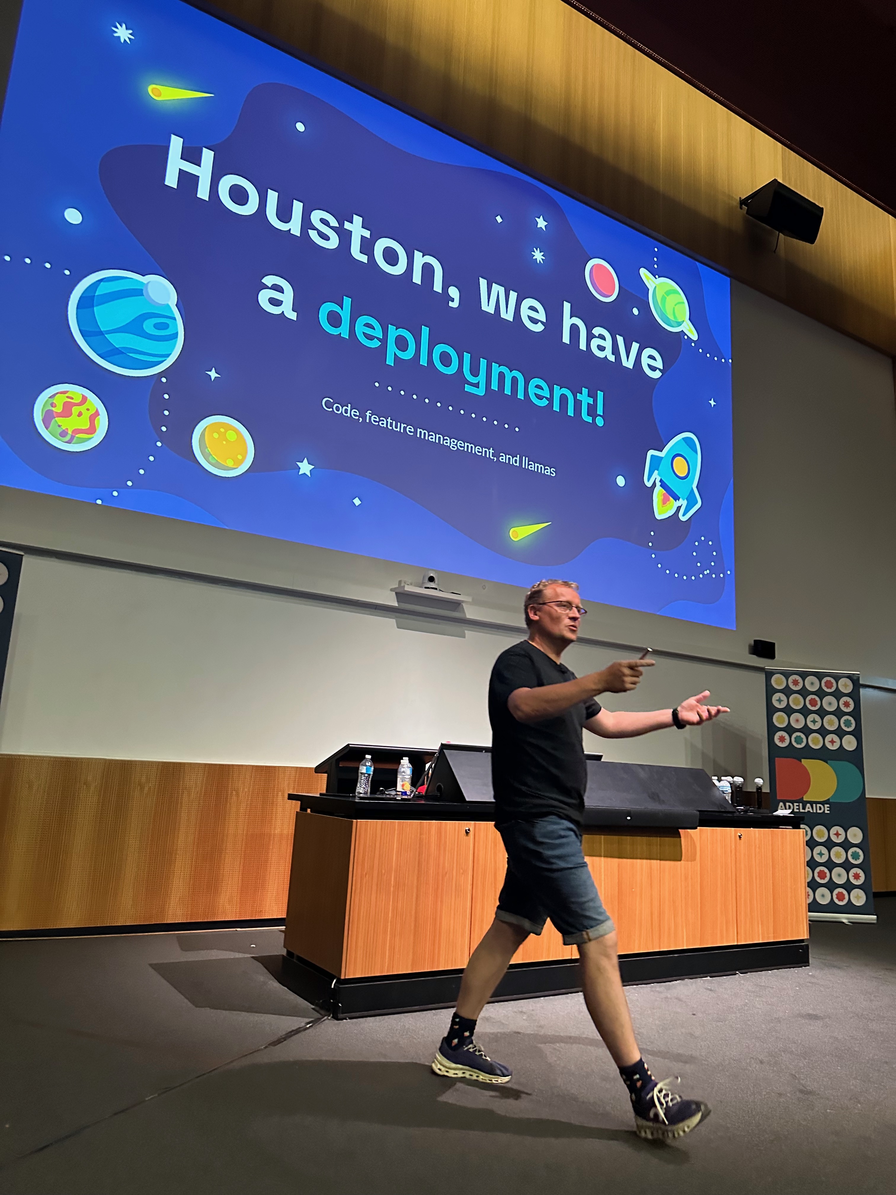 Lars standing in front of a presentation slide titled 'Houston we have a deployment'.