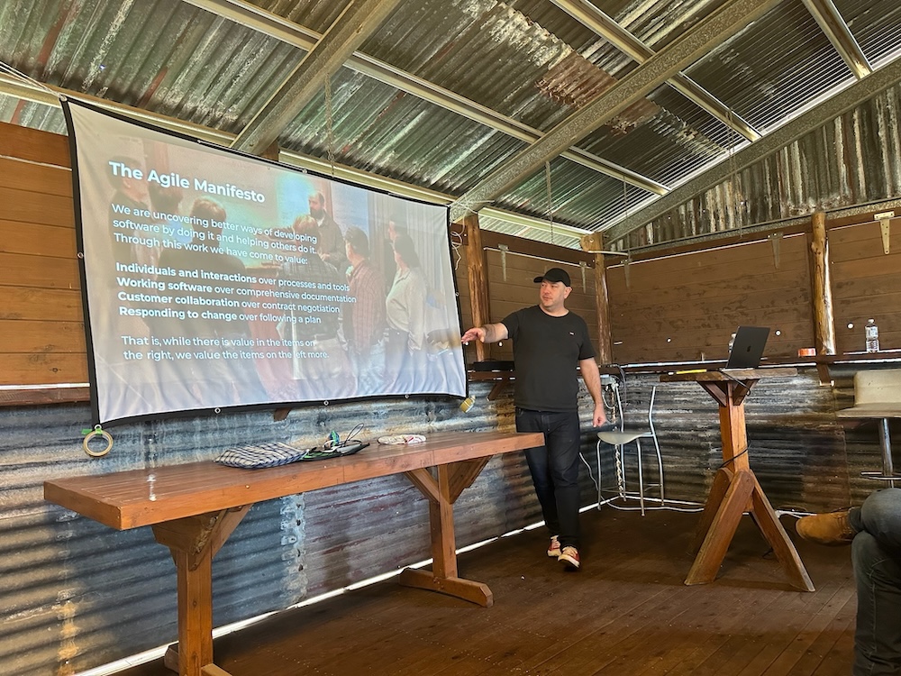 Me pointing at slide about the Agile Manifesto
